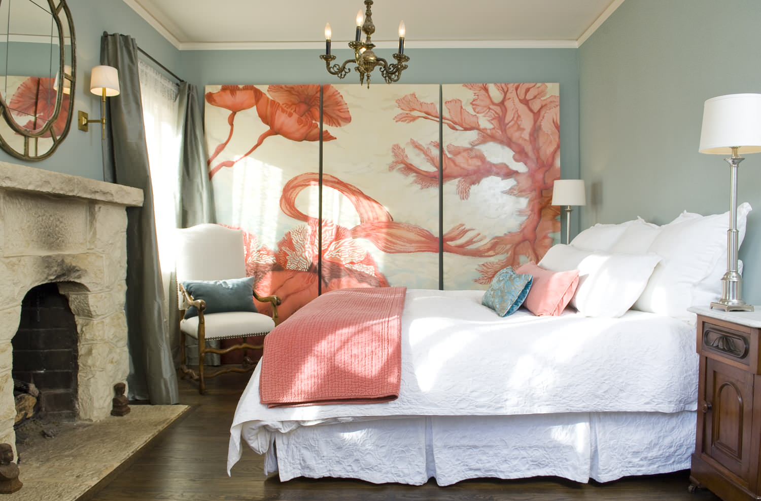 Statement pieces used as unique artworks in this bedroom featuring a large mural.
