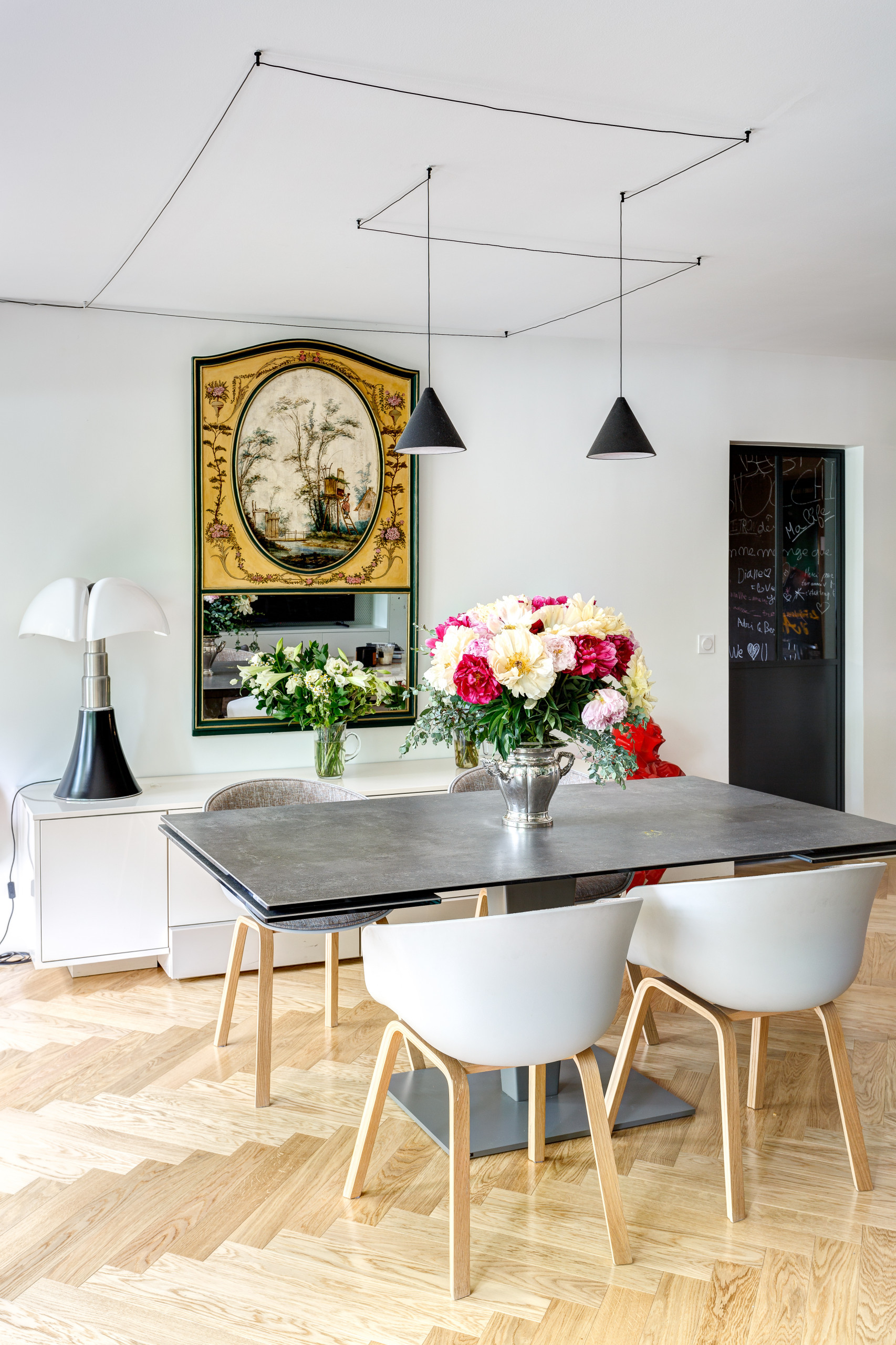 Statement pieces used as unique artworks in this dining room featuring a vintage storage