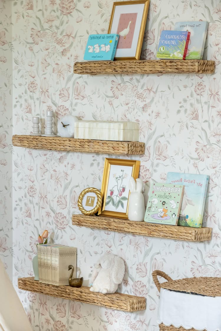 Vintage inspired nursery example featuring a traditional style with patterned wallpaper