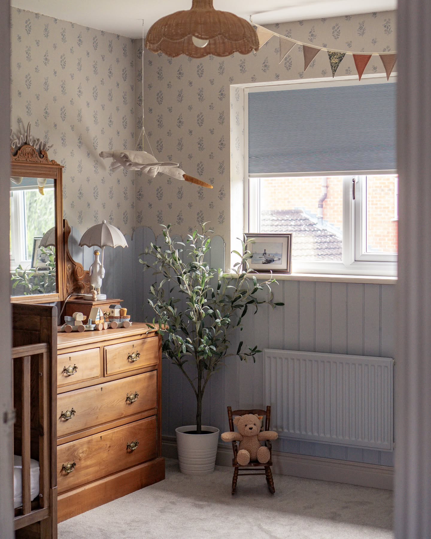 Vintage inspired nursery example featuring a traditional style in neutral color scheme