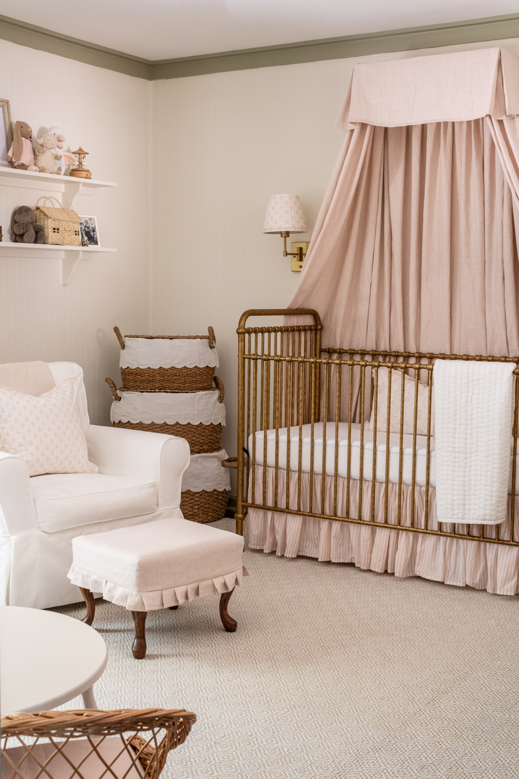 Vintage inspired nursery example featuring a traditional style in dusty pink color scheme