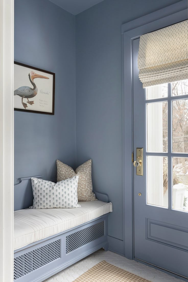 Color drenching idea showing a mudroom in a cream mid blue