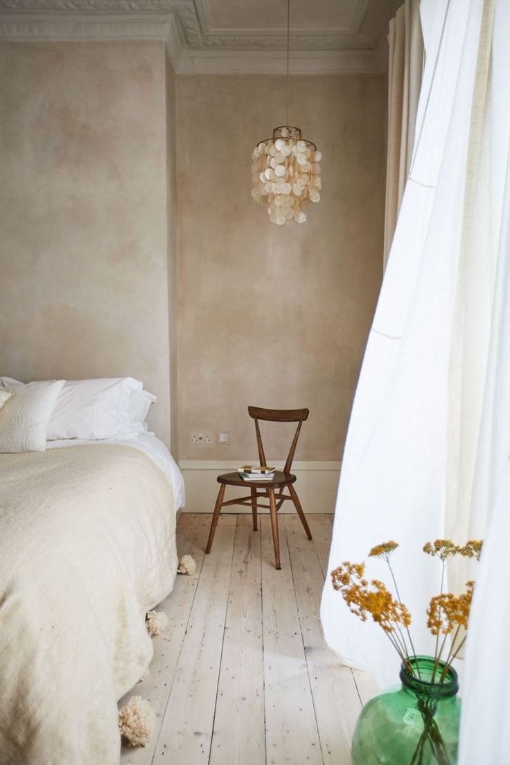 Textured wall treatments ideas showcasing an example in earthy white plaster