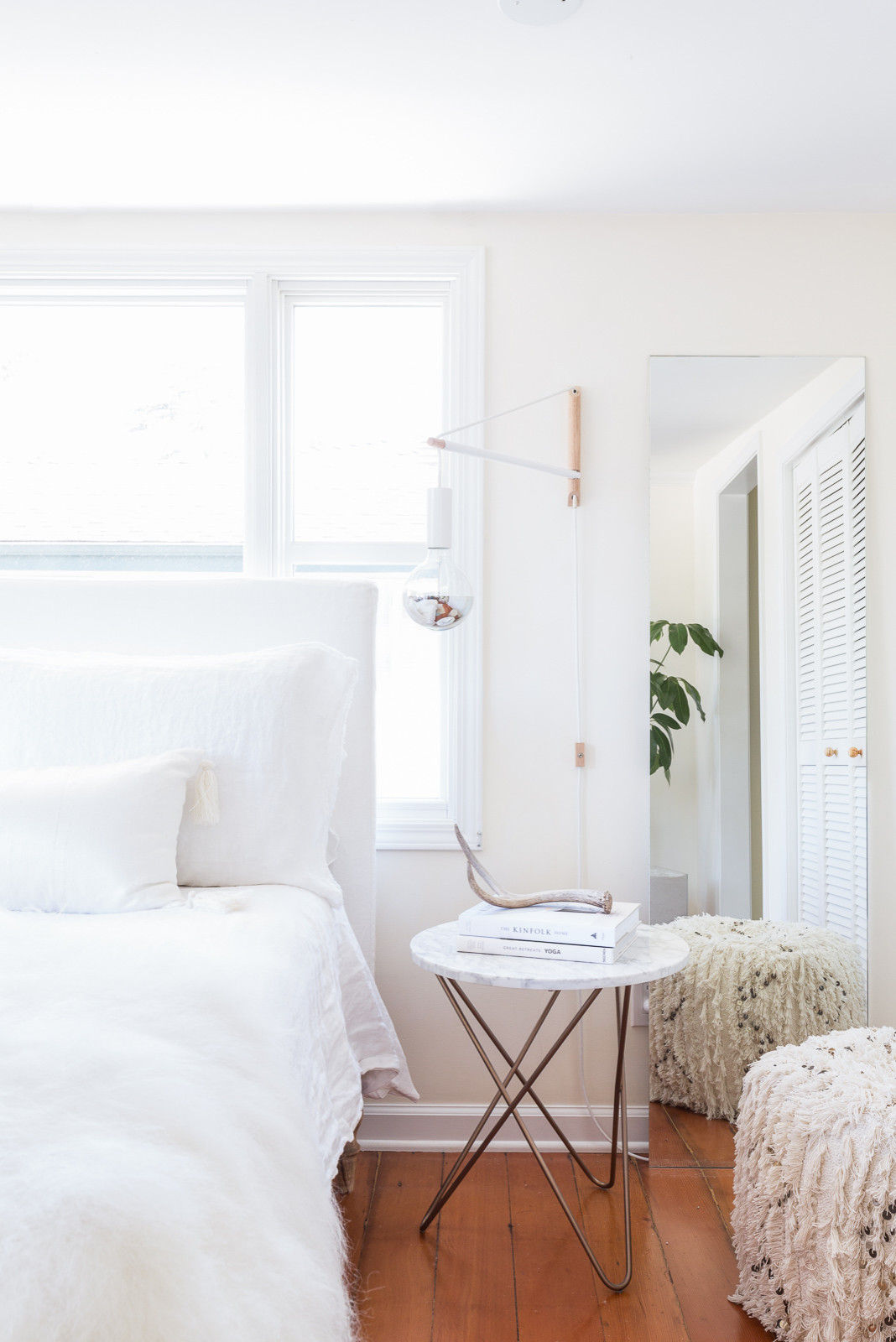 Neutral bedroom ideas in Scandinavian style featuring large window