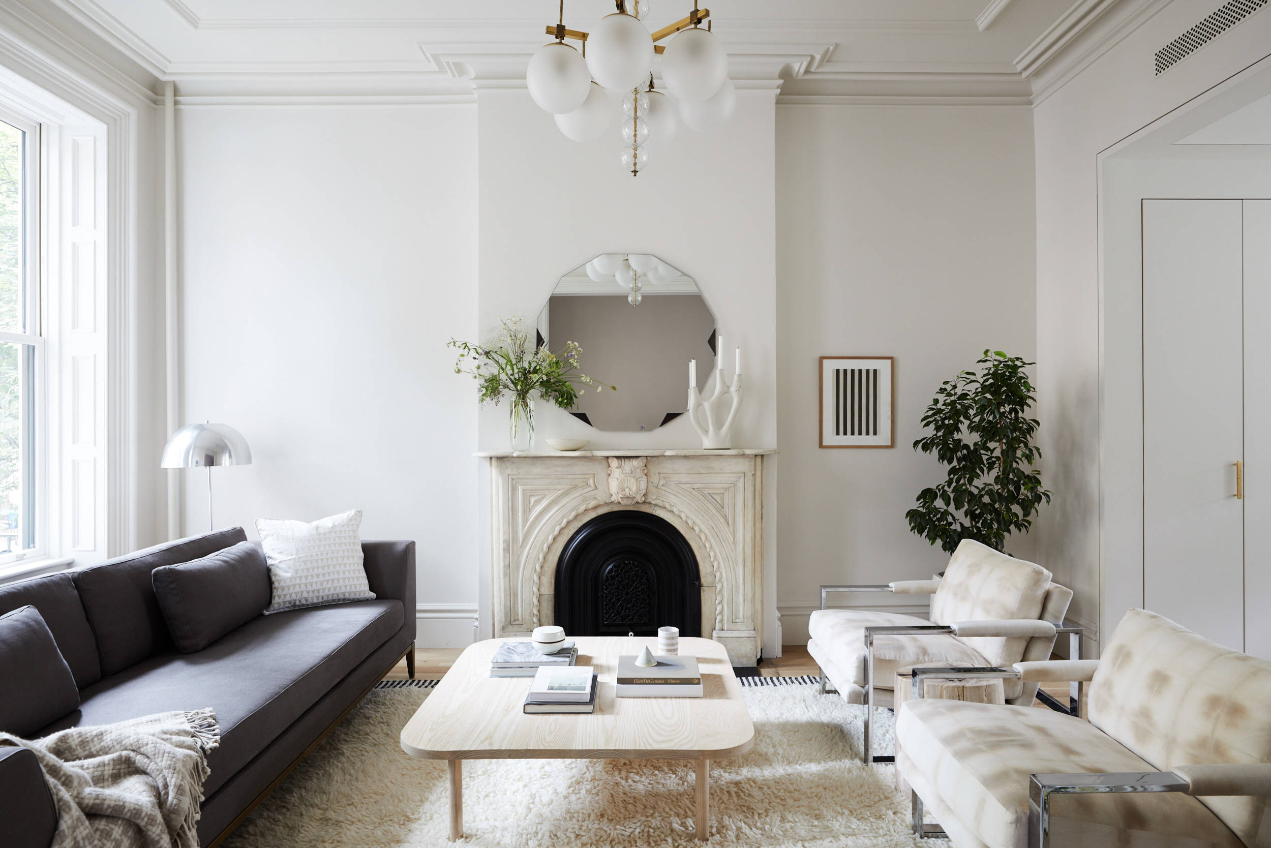 Example of transitional mantel decor style featuring a modern traditional look