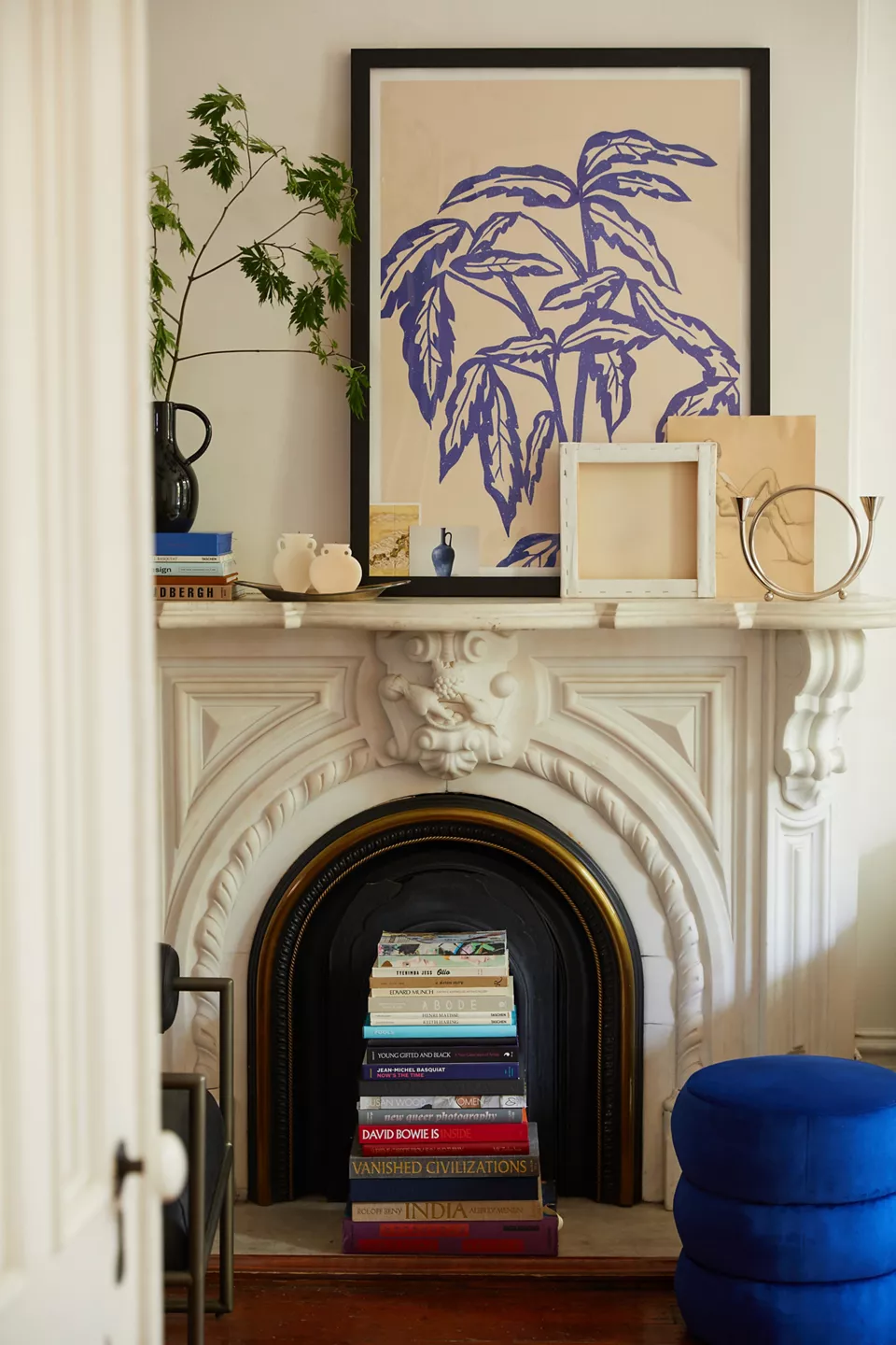 Example of transitional mantel decor style featuring a contemporary eclectic look