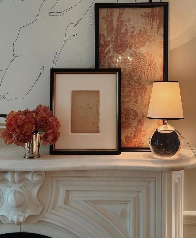 Example of transitional mantel decor style featuring a contemporary look