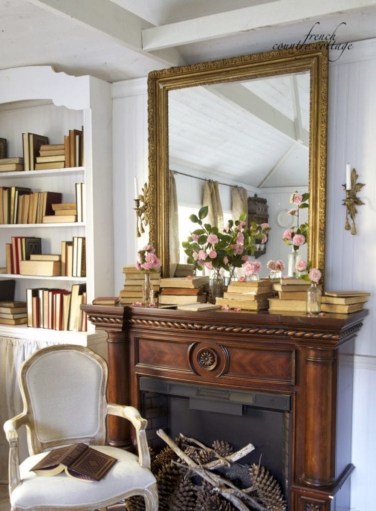 Example of transitional mantel decor style featuring a modern european cottage look