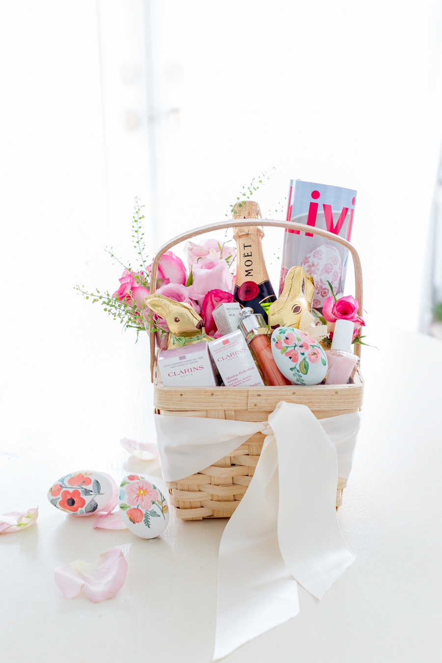 Last-minute Easter basket ideas featuring a rattan basket in glam style for adults.