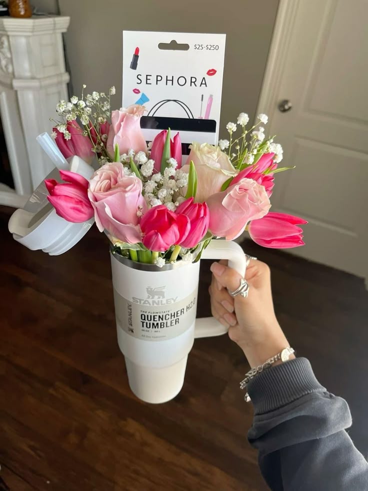 Last-minute Easter basket ideas featuring a neutral tumbler as a basket with florals for adults and teens.