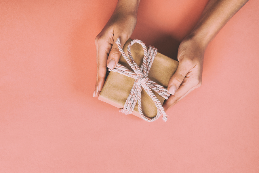 Picture featuring women's hand holding a gift example as Mother’s Day gift guide idea