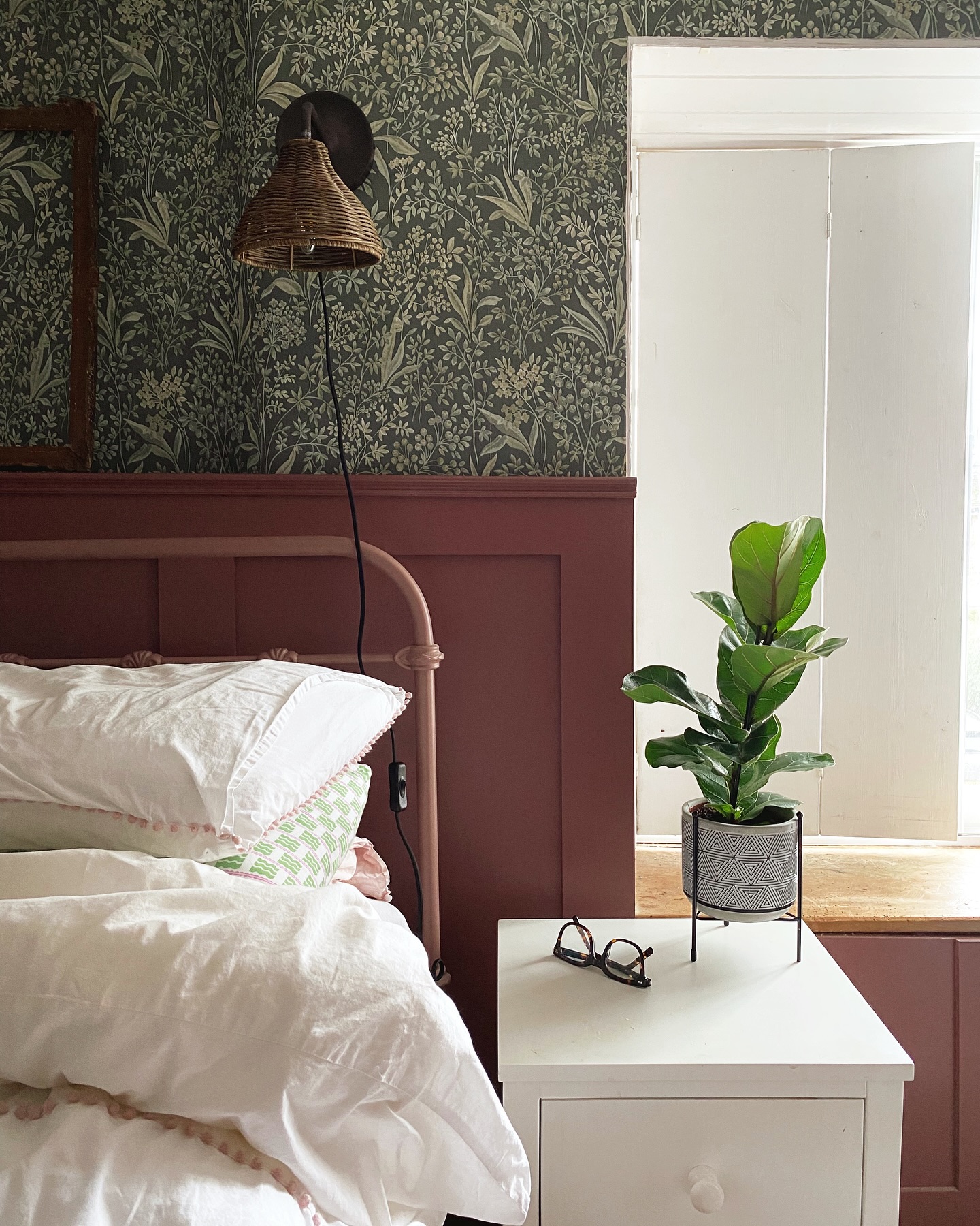 Example of cottagecore bedroom ideas featuring romantic style with floral wallpaper in green and white