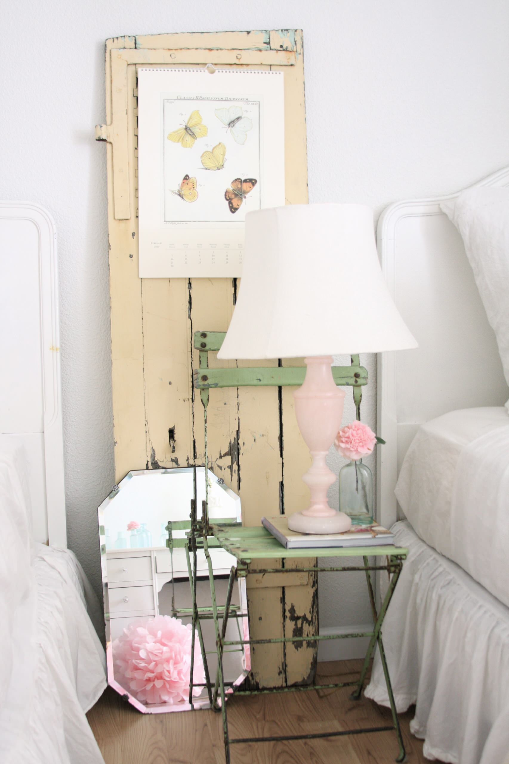 Example of cottagecore bedroom ideas featuring shabby chic style with white and light green color scheme