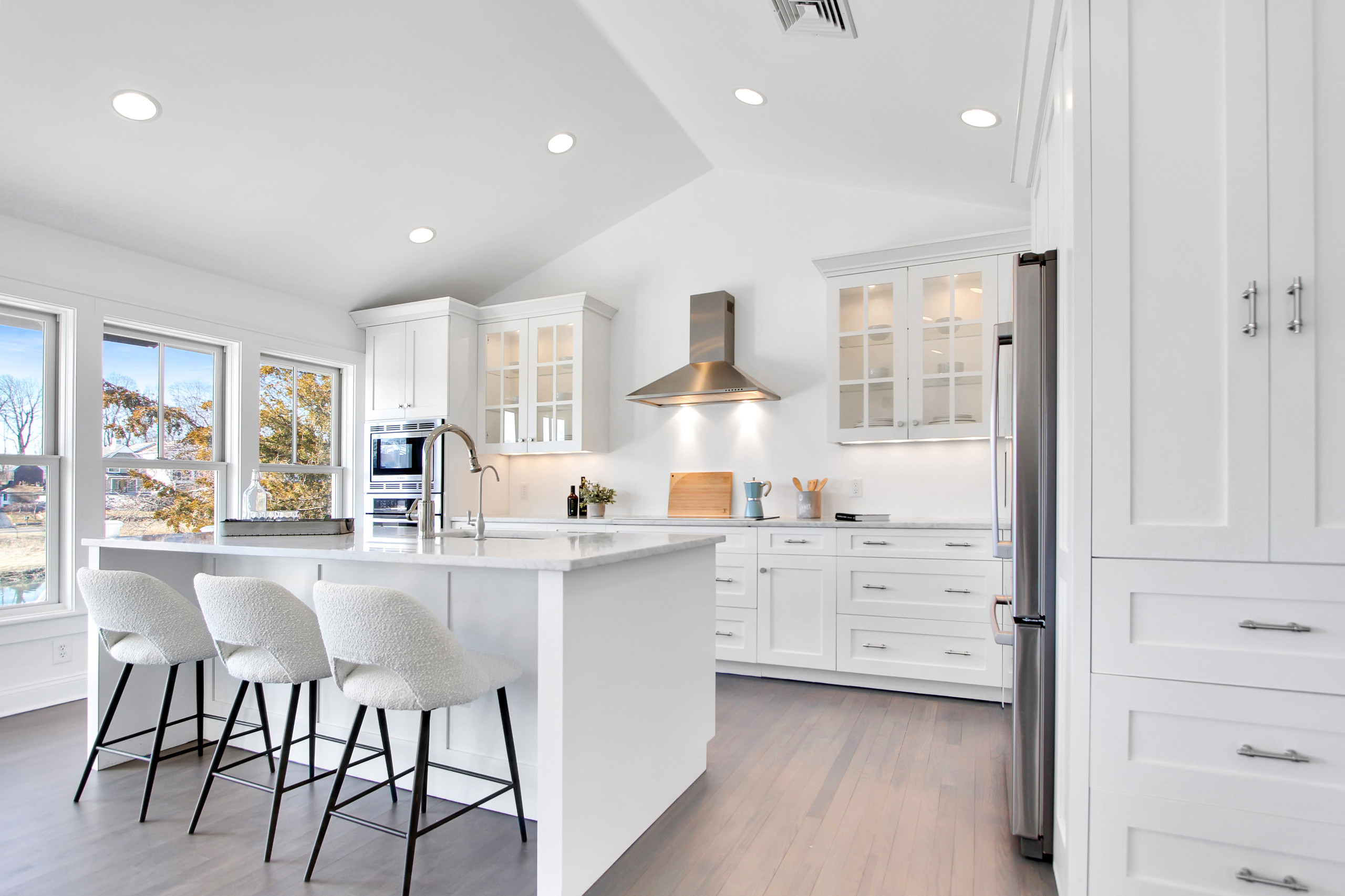 boucle fabric example featuring a kitchen island stools in modern coastal style