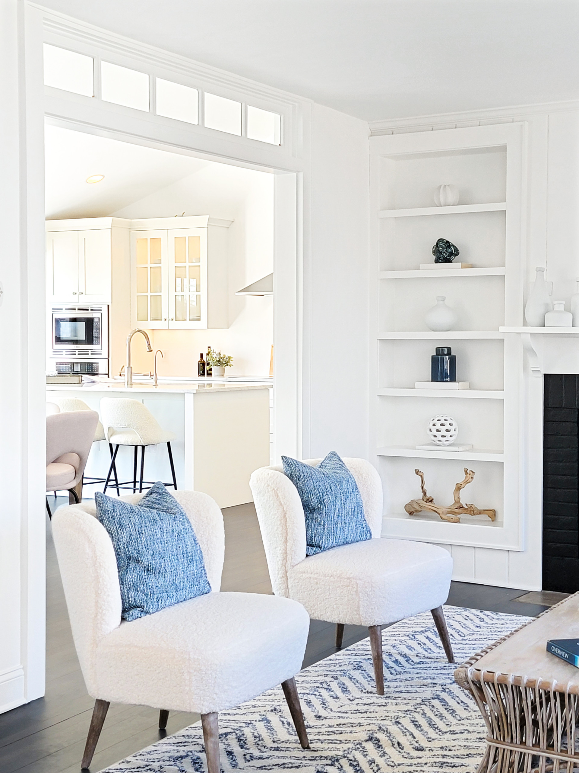 boucle fabric example featuring a living room with accent chairs in modern coastal style