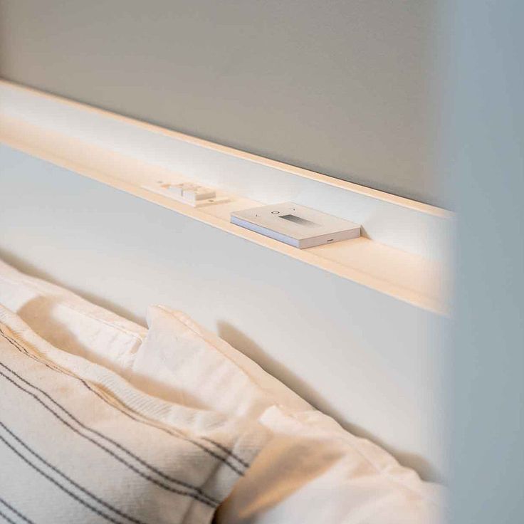 bed in contemporary style featuring smart home lighting strips