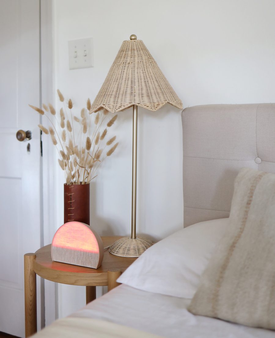 bedroom in coastal style featuring smart home sun alarm clock