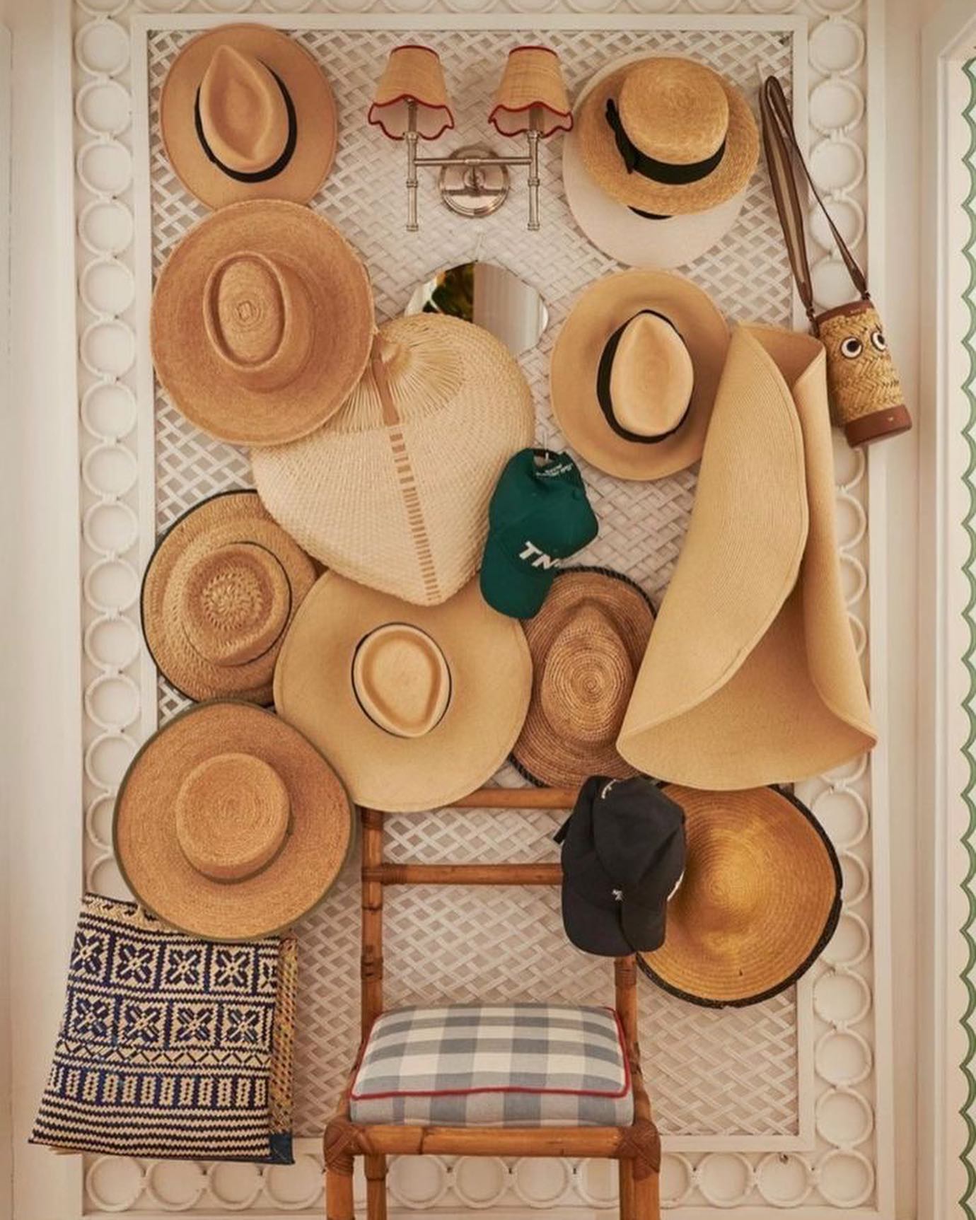 entryway with collection of straw hats in cottage style example of thrifted cottagecore decor finds aesthetic