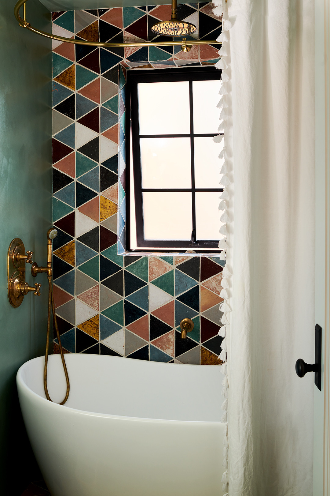 airy bathroom in coastal chic brownstone with boho touches