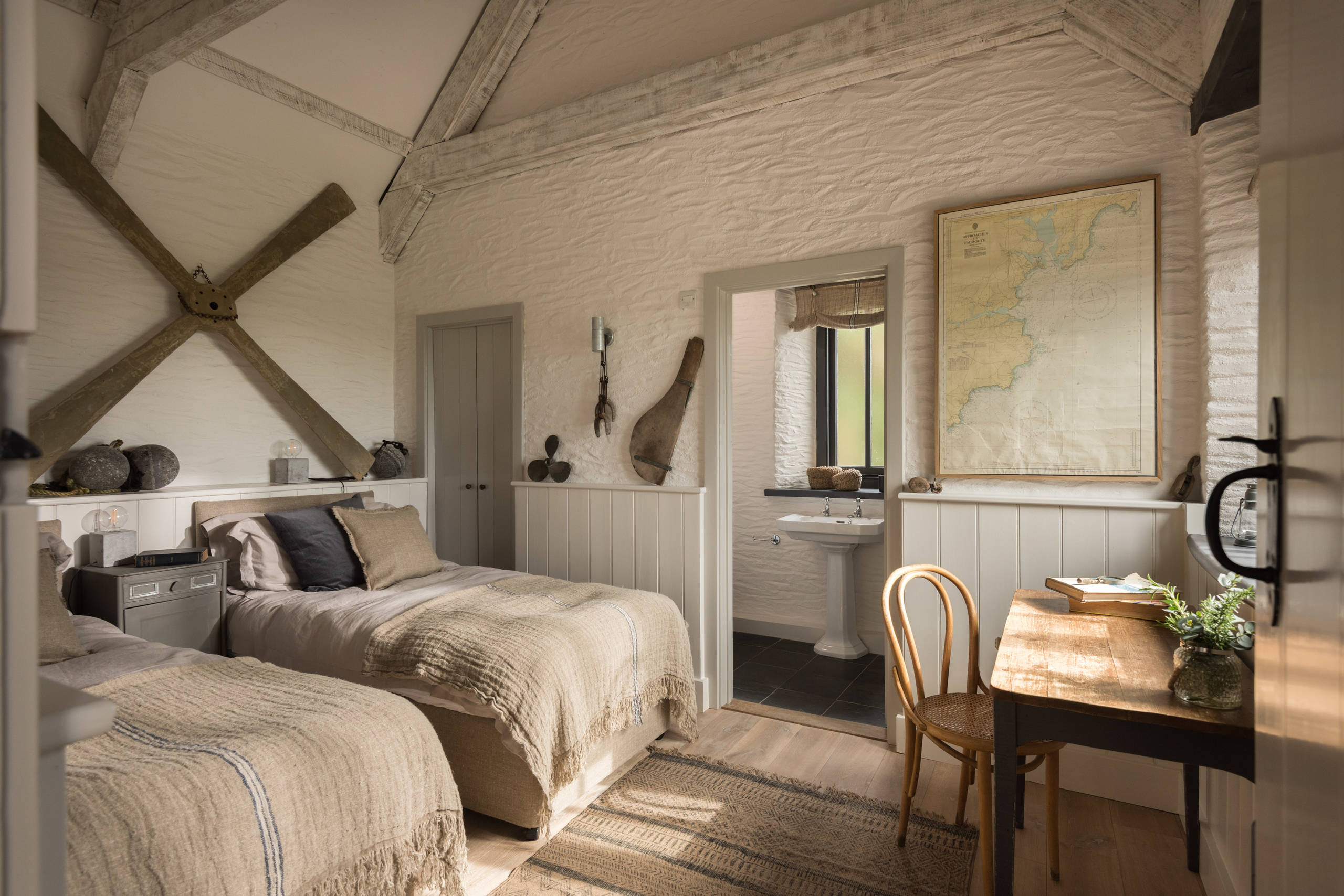 Coastal bedroom that shows the fisherman aesthetic trend in a traditional style.