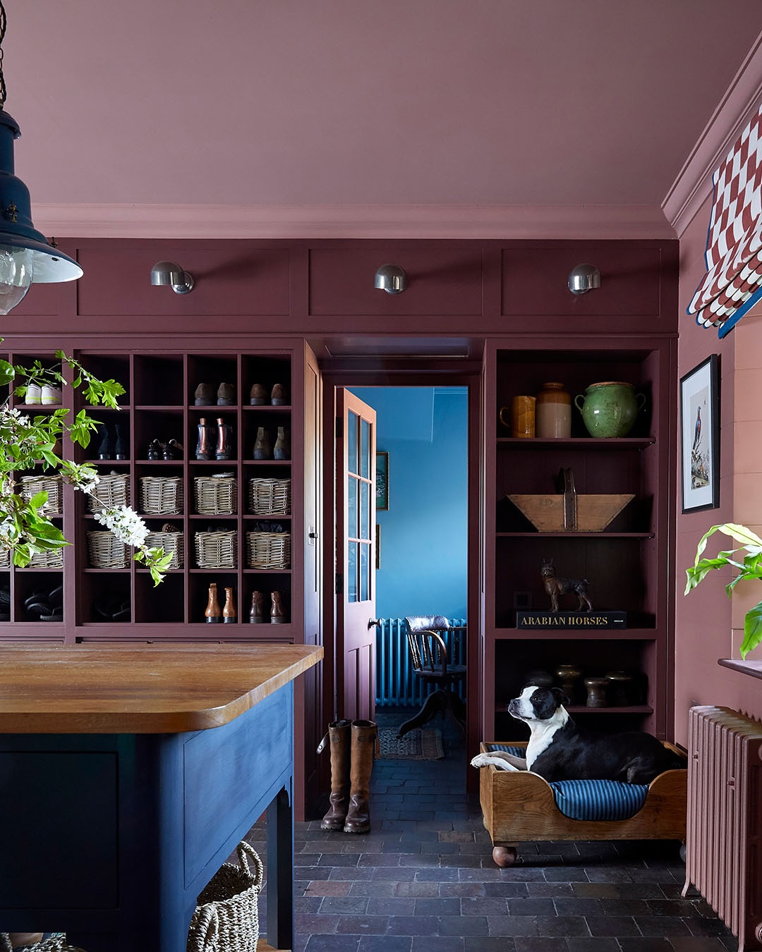 Burgundy and navy fall decorating in a traditional cottage english kitchen featuring burgundy walls and blue kitchen island