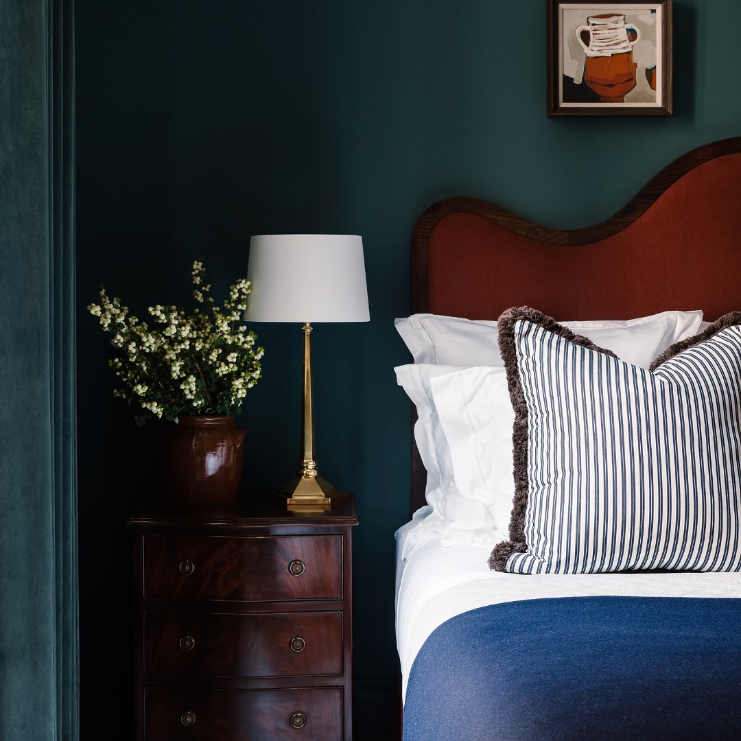 Burgundy and navy fall decorating in a traditional bedroom