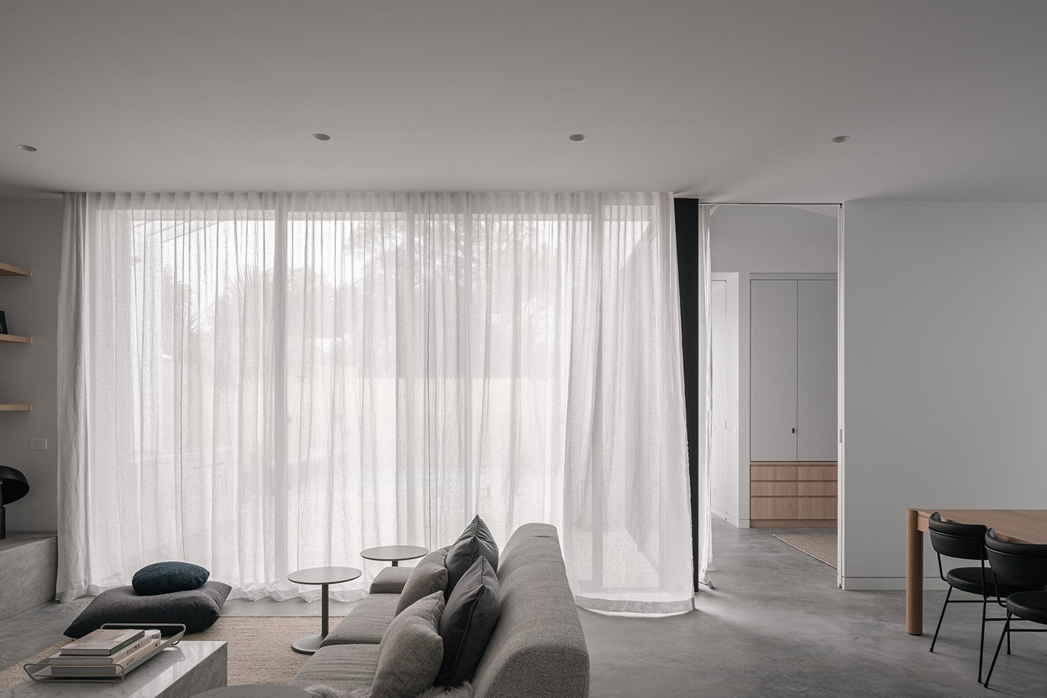 Modern minimalist decor family home featuring white and gray living room