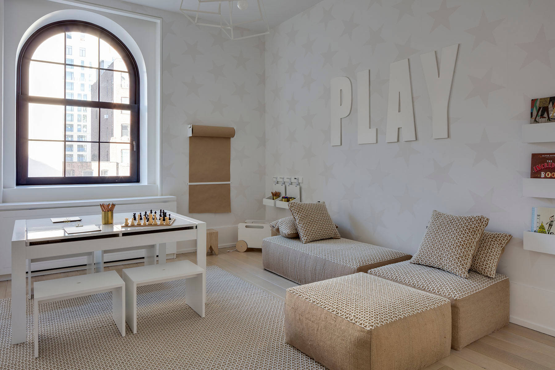 Modern minimalist decor family home featuring playroom in neutral tones