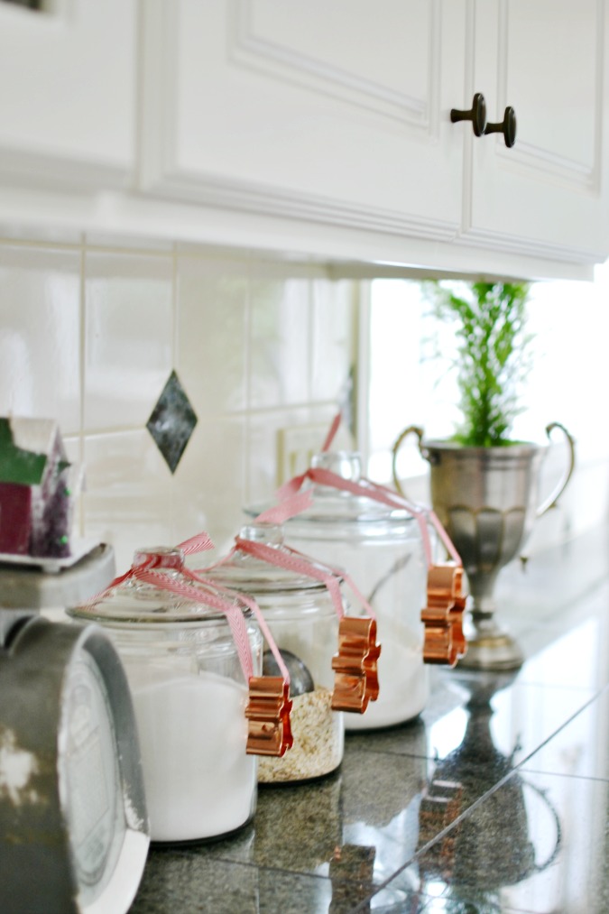 Budget Christmas kitchen styling tips and ideas featuring jars with festive details