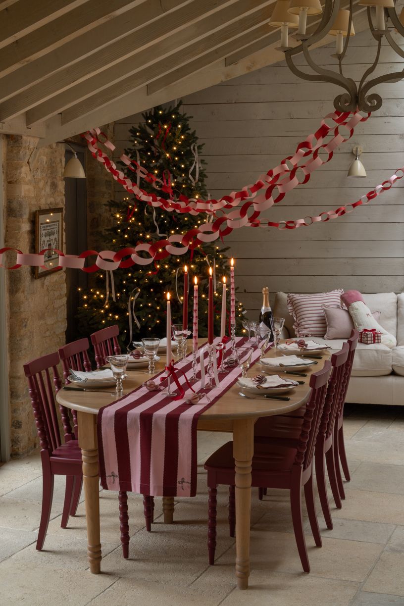 Budget Christmas kitchen styling tips and ideas featuring red and pink dining room in open kitchen
