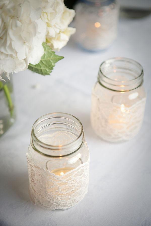 clear mason jars with lace and candle as neutral easter decor idea