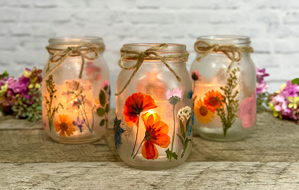 DIY idea of mason jars as candles with flower petals
