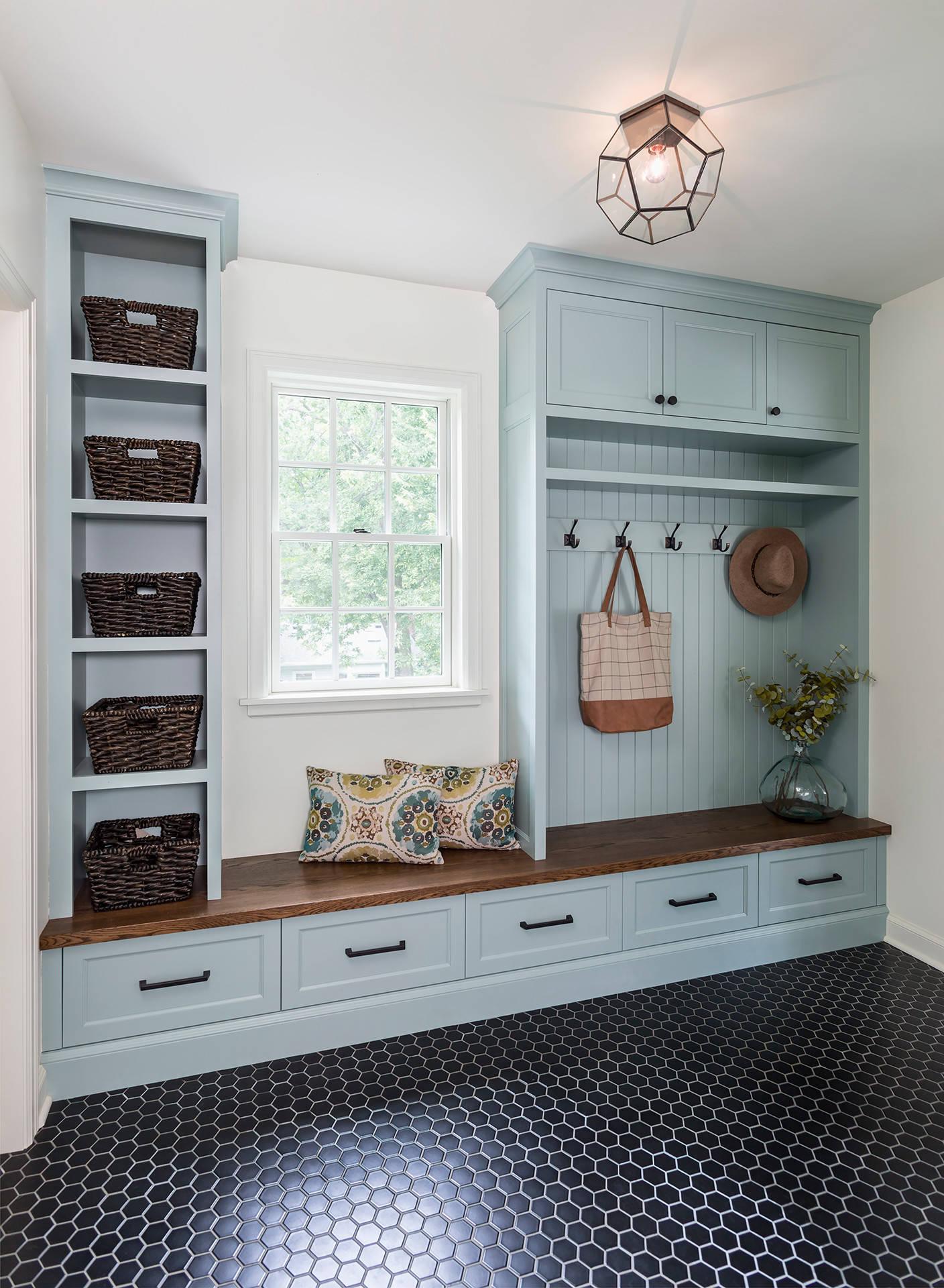 Organic modern cottage mudroom featured in home tour
