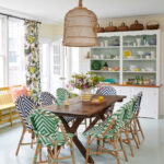 Whimsical coastal cottage interior featuring a home casual dining room in home tour