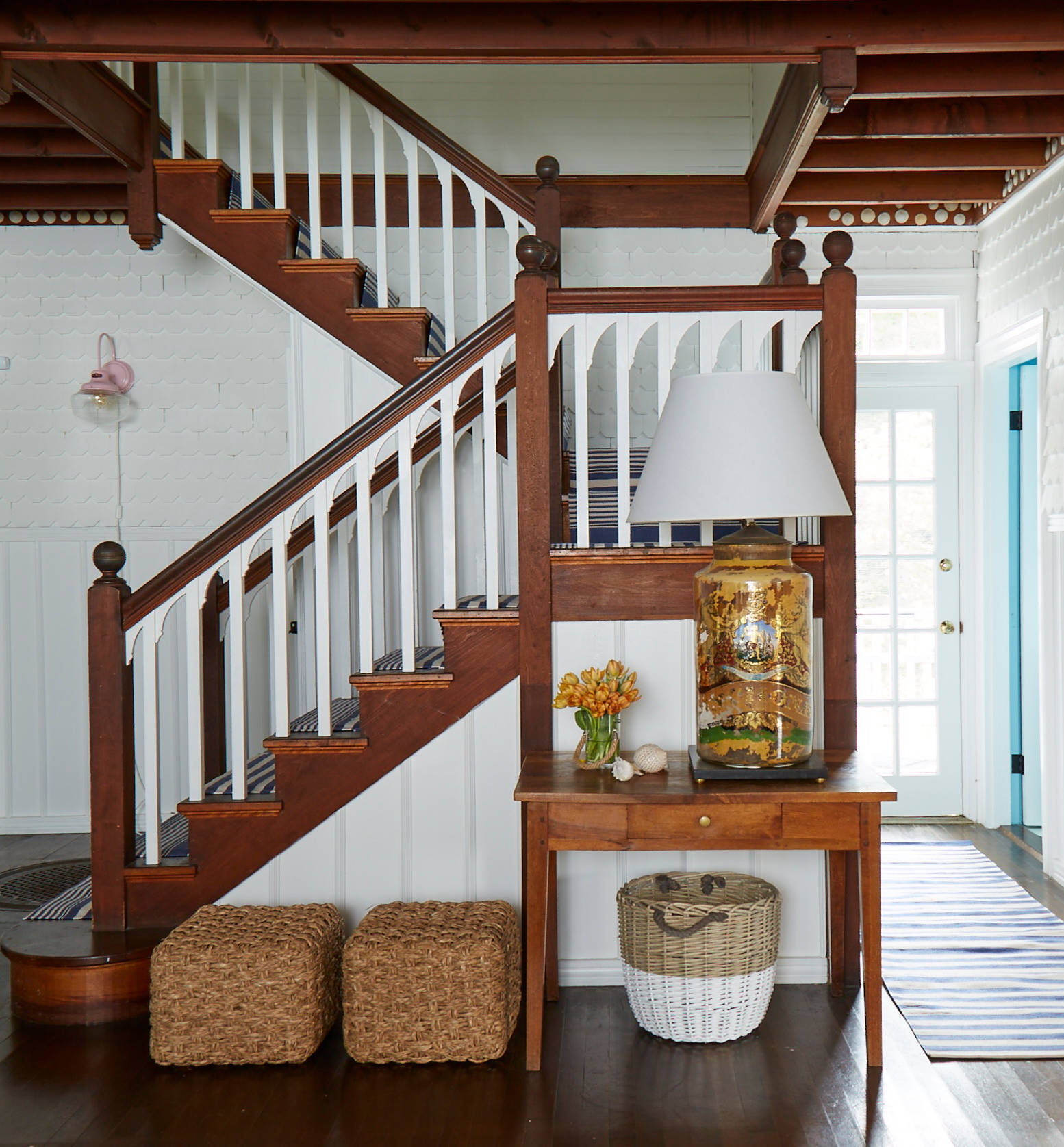 Whimsical coastal cottage interior featuring a home entry room in home tour