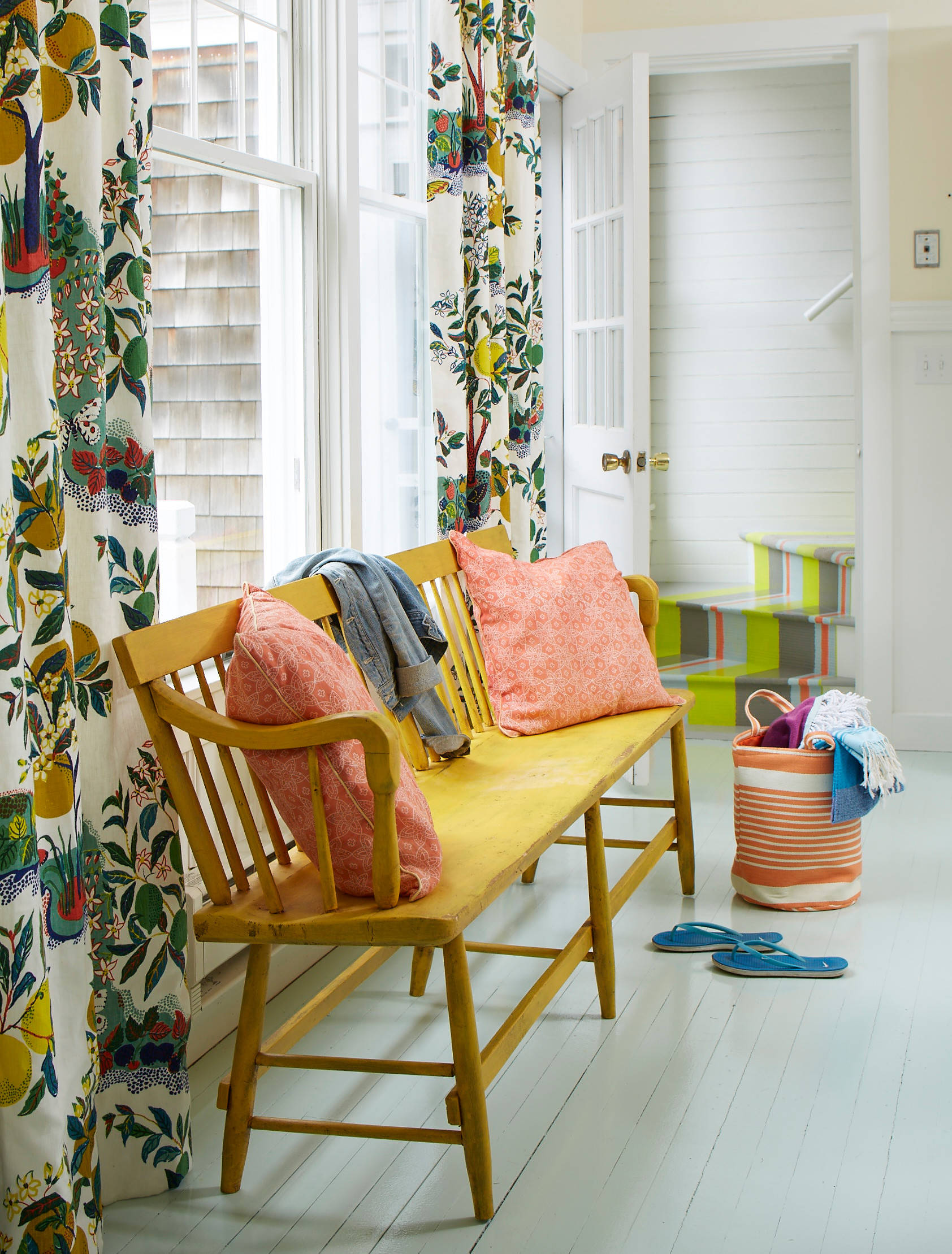 Whimsical coastal cottage interior featuring a home casual entry room in home tour