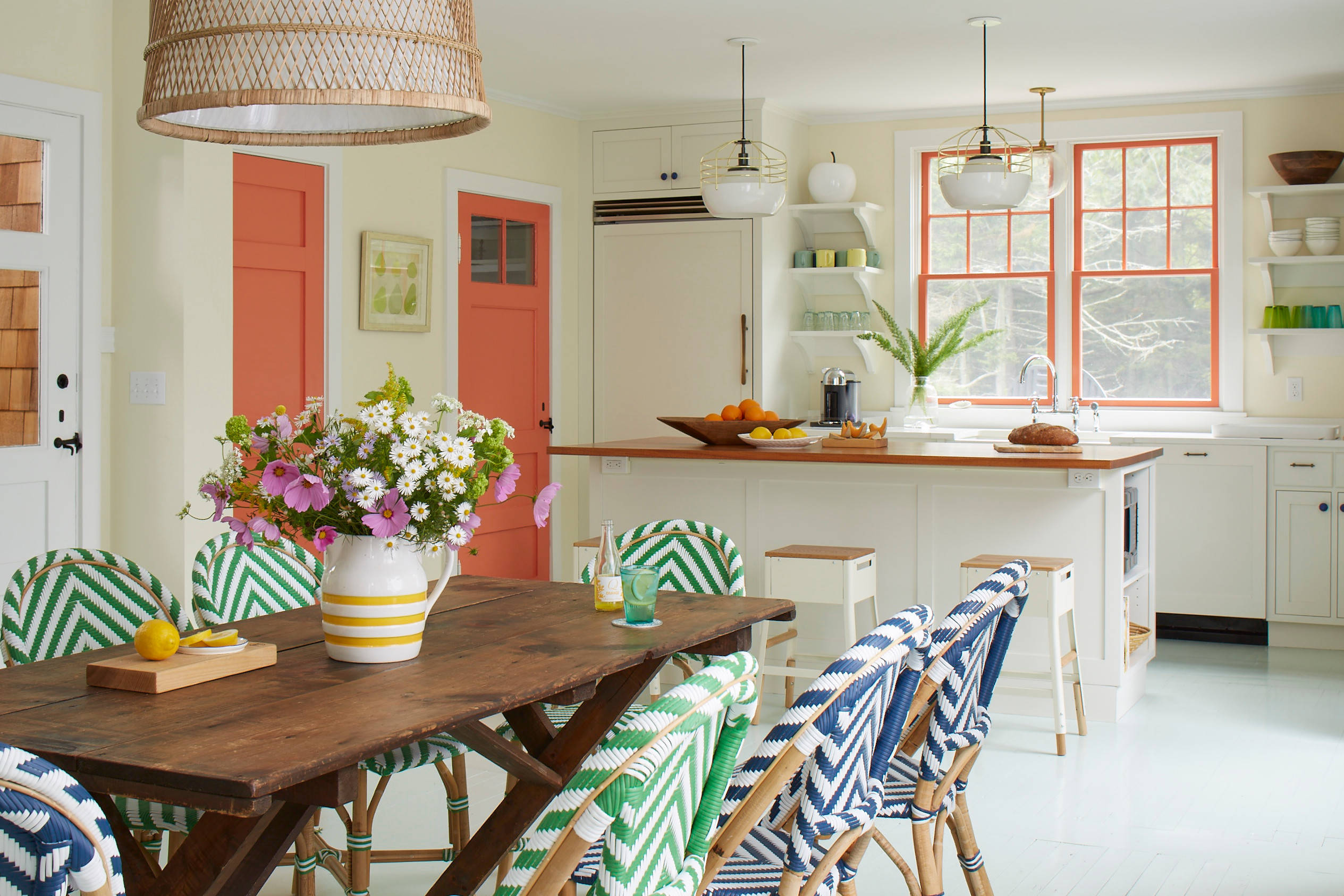 Whimsical coastal cottage interior featuring a home casual dining room in home tour