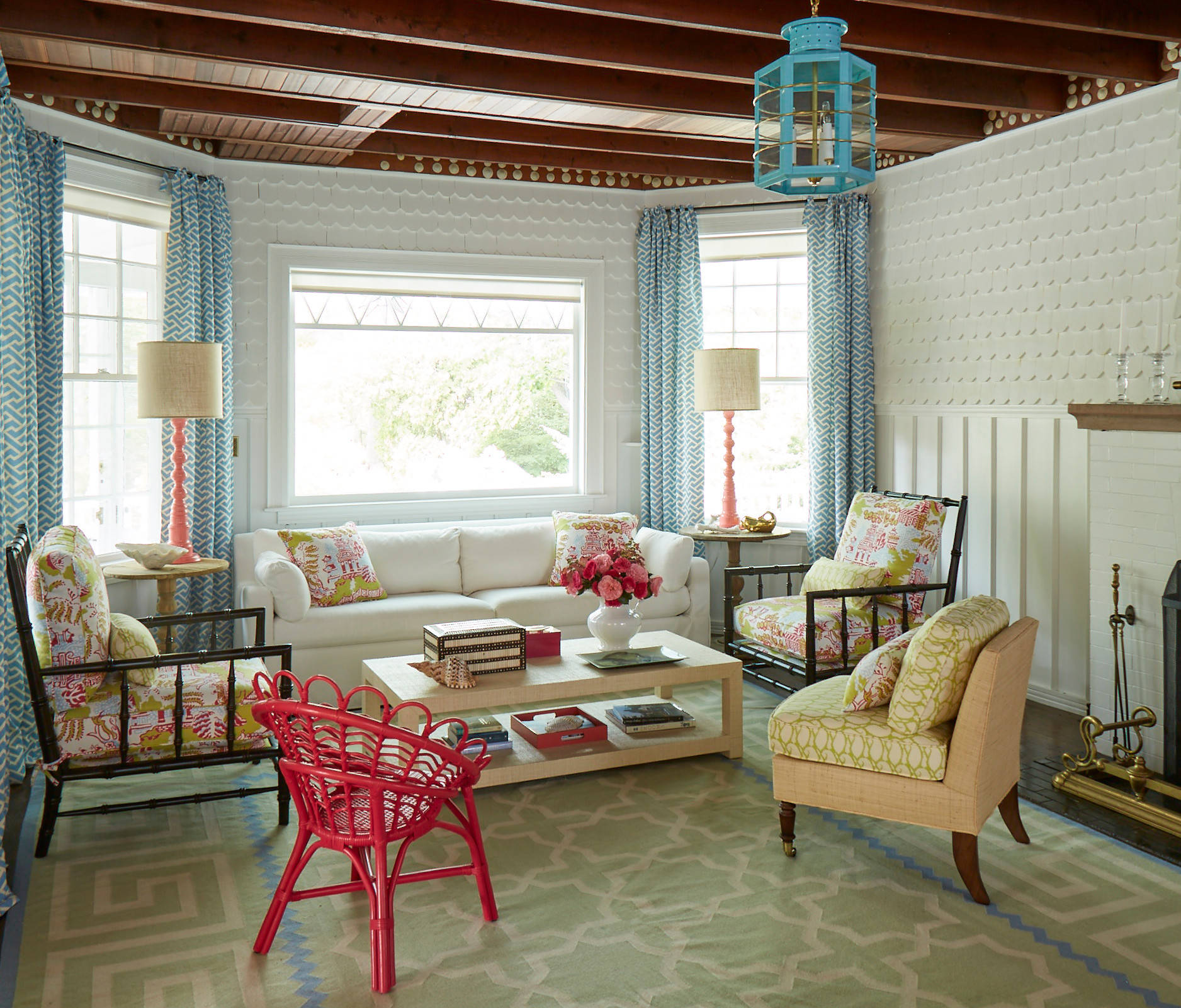 Whimsical coastal cottage interior featuring a home casual living room in home tour