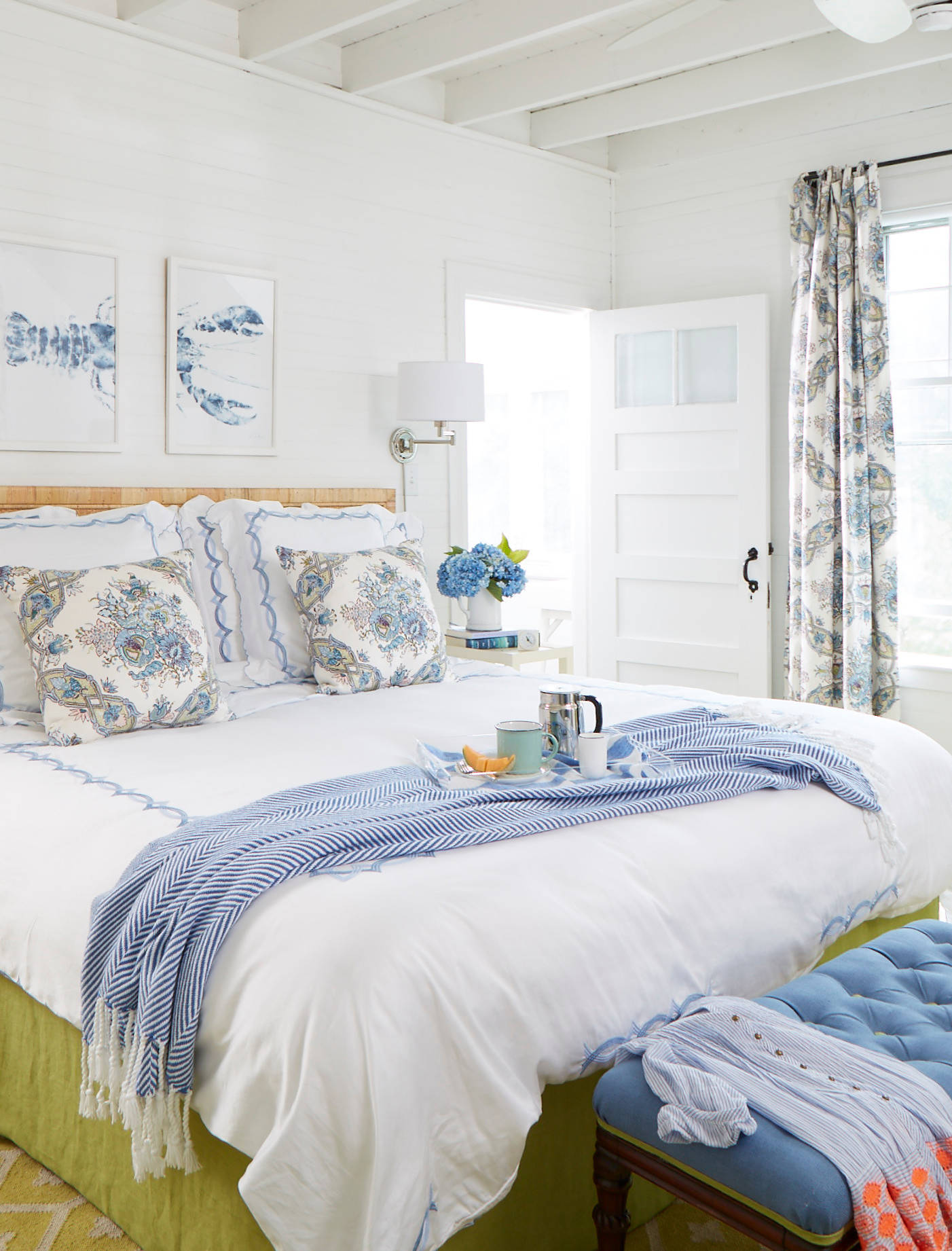 Whimsical coastal cottage interior featuring a home bedroom in home tour