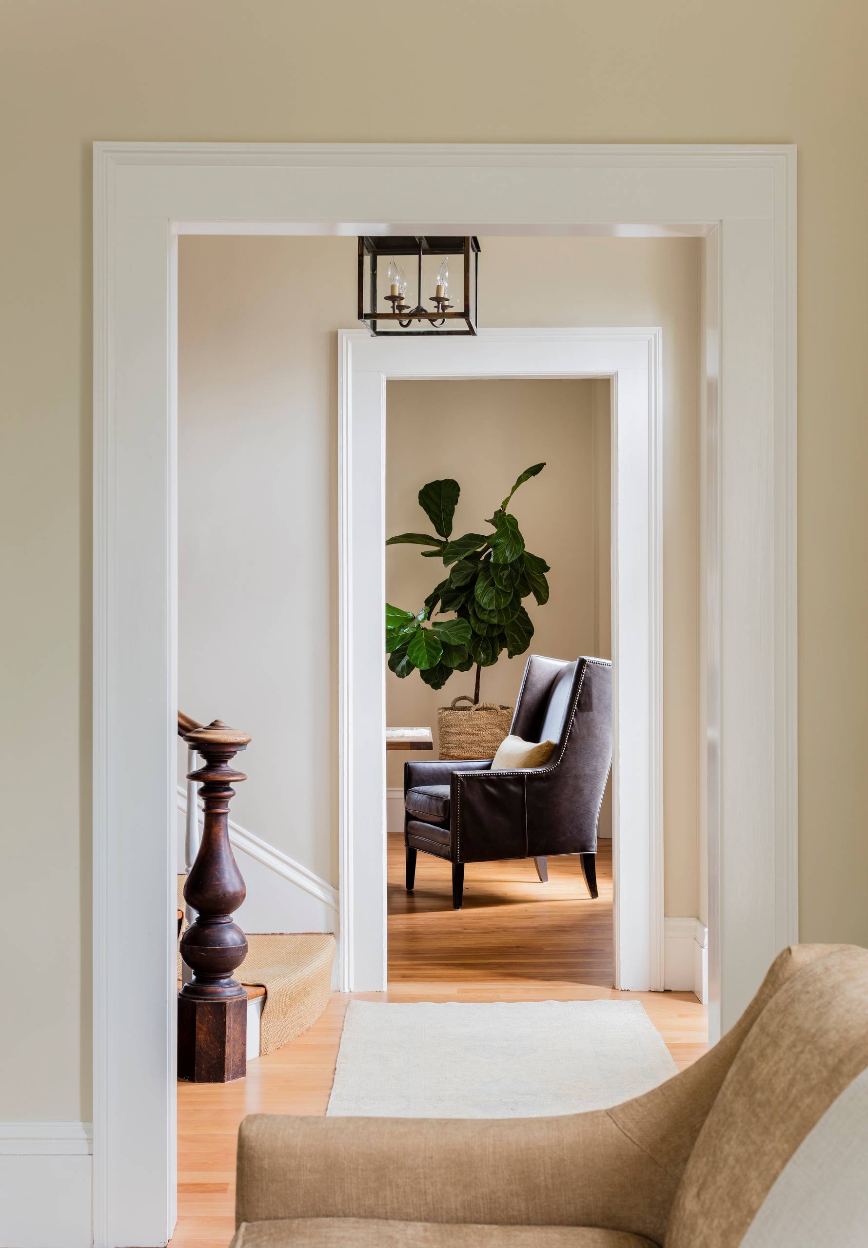 Living room with transitional historical renovation in New England featured of Styled and Comfortable Family Home Tour