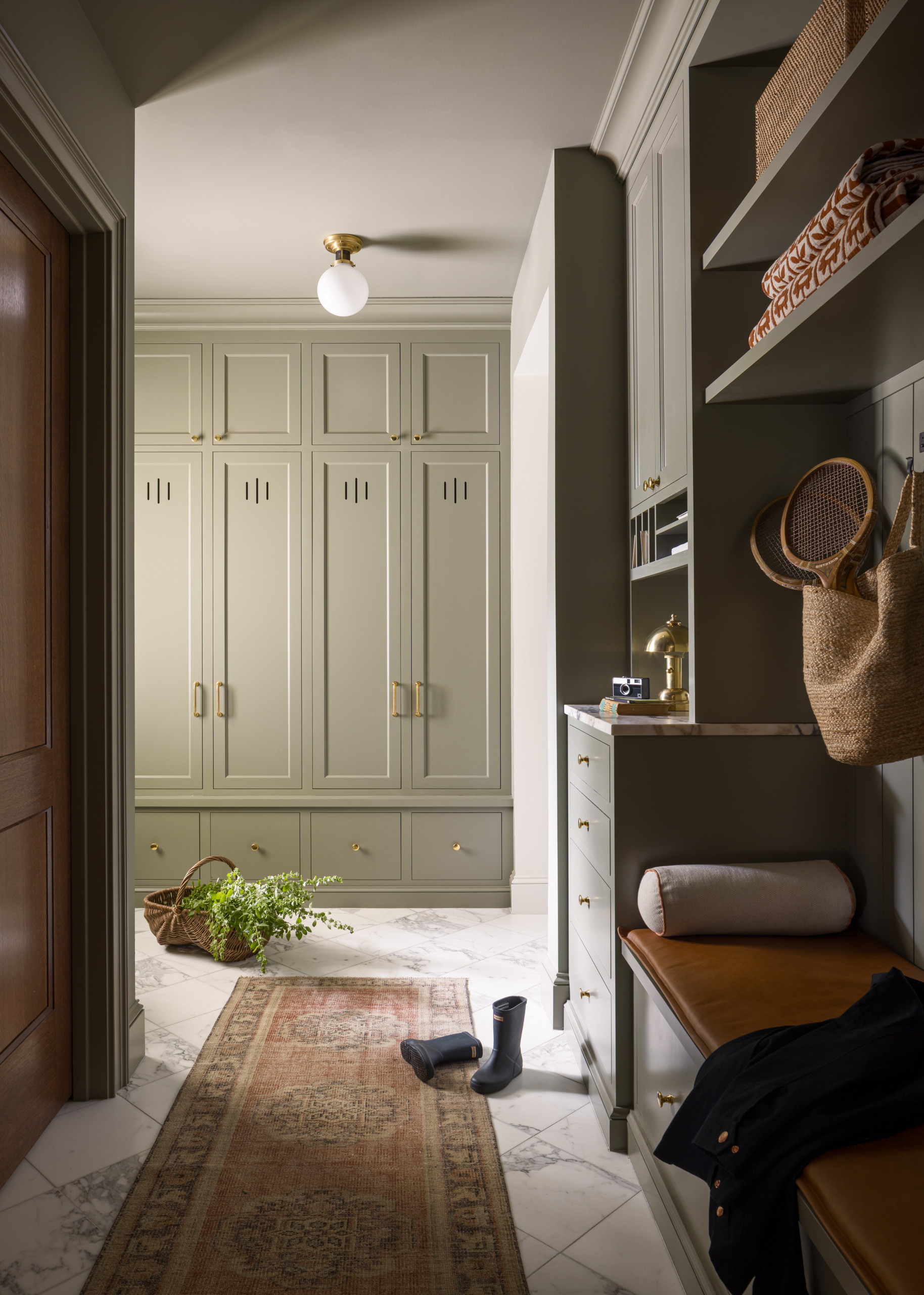 Mudroom featured in Lee Boulevard Home Tour as an example of a Historic Home Renovation with a transitional modern heritage style.
