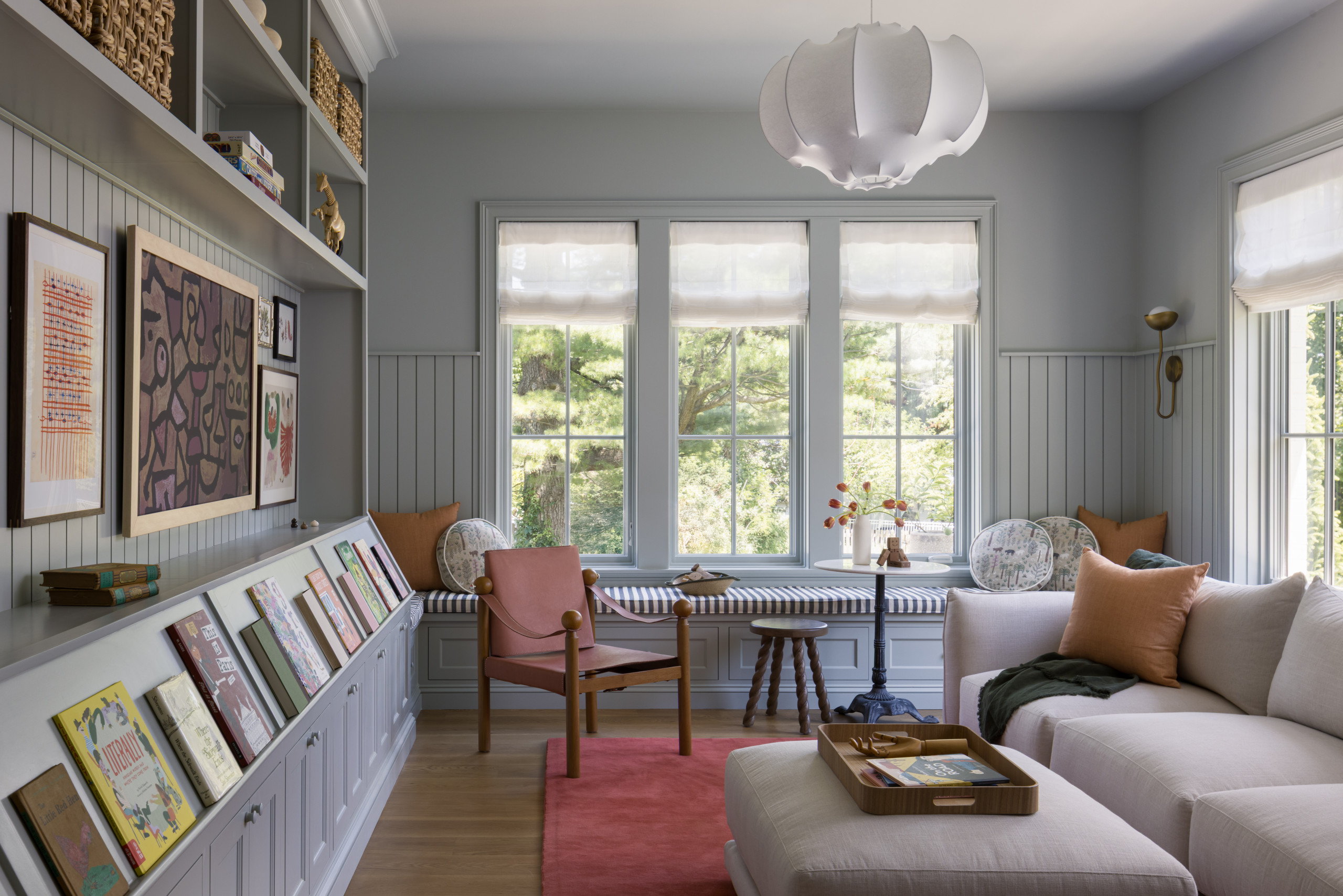Family rom featured in Lee Boulevard Home Tour as an example of a Historic Home Renovation with a transitional modern heritage style.