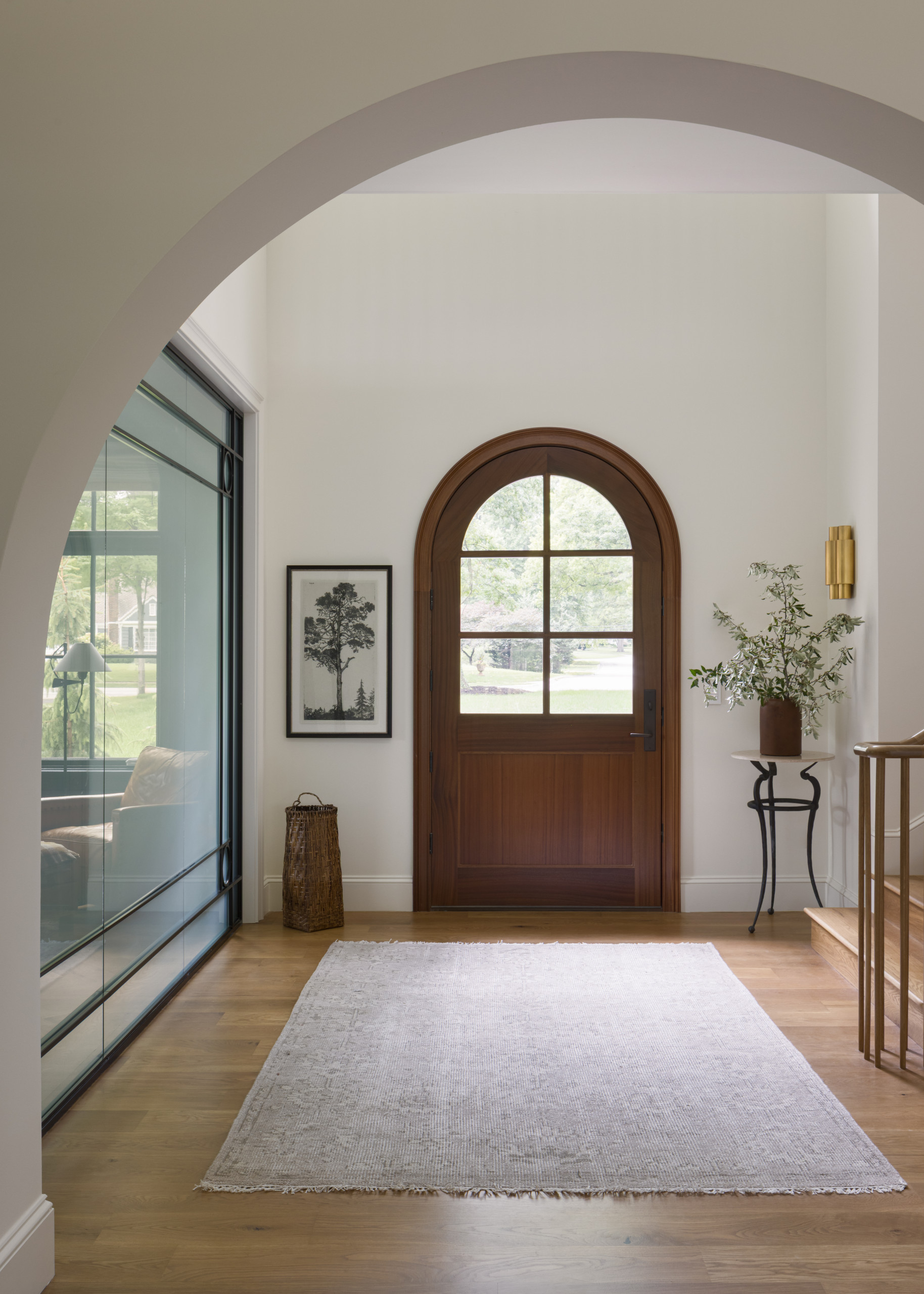 Entry room featured in Lee Boulevard Home Tour as an example of a Historic Home Renovation with a transitional modern heritage style.