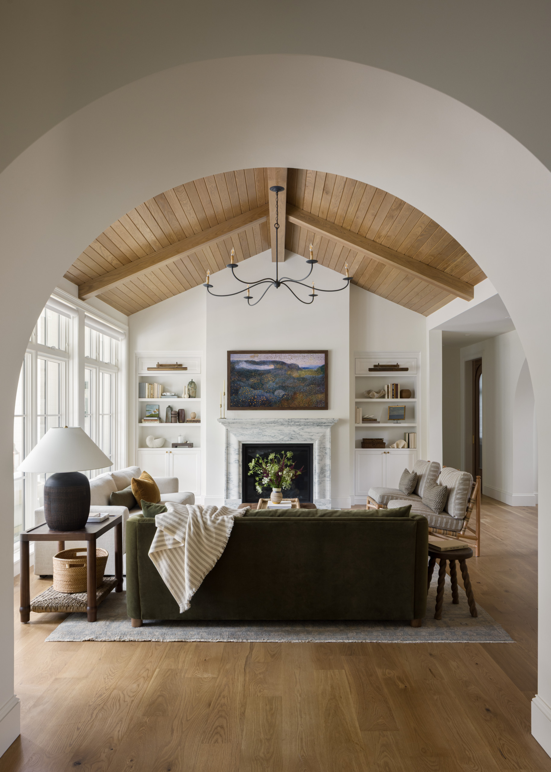 Living room featured in Lee Boulevard Home Tour as an example of a Historic Home Renovation with a transitional modern heritage style.