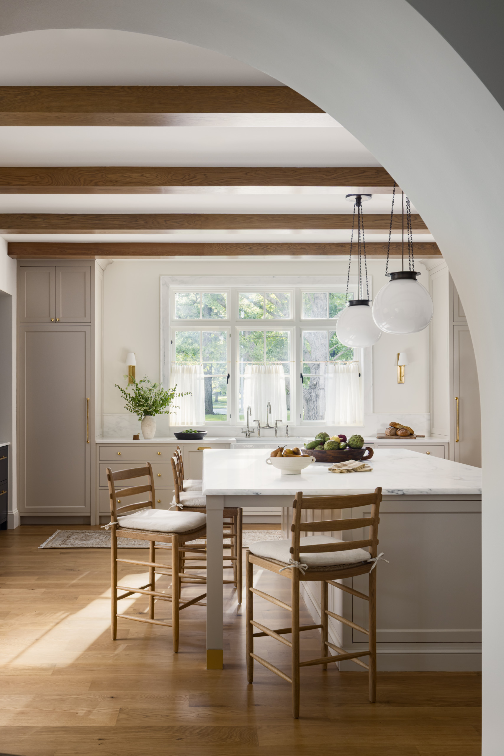 Kitchen featured in Lee Boulevard Home Tour as an example of a Historic Home Renovation with a transitional modern heritage style.