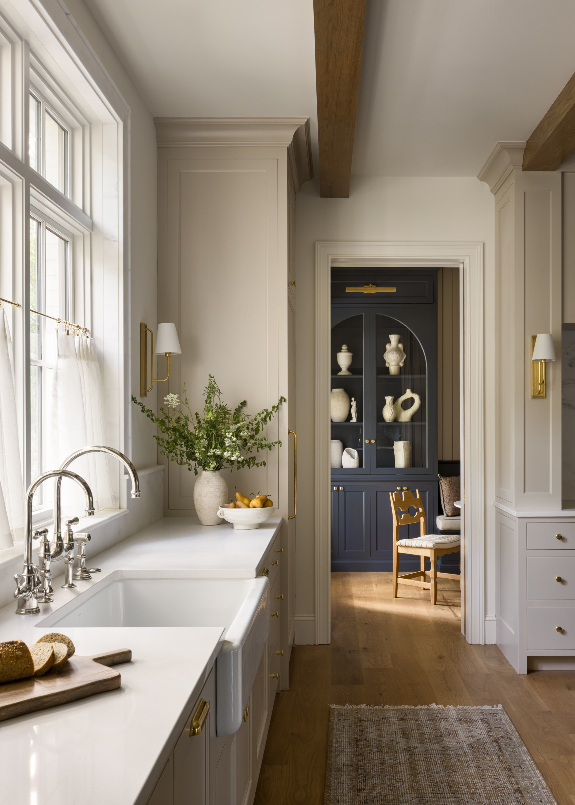 Kitchen featured in Lee Boulevard Home Tour as an example of a Historic Home Renovation with a transitional modern heritage style.