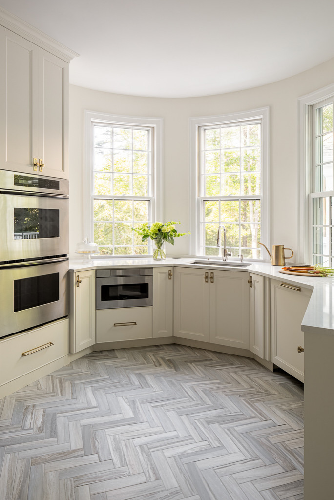 Coastal home tour featuring beach house interiors with a modern take on traditional style fwaturing a kitchen