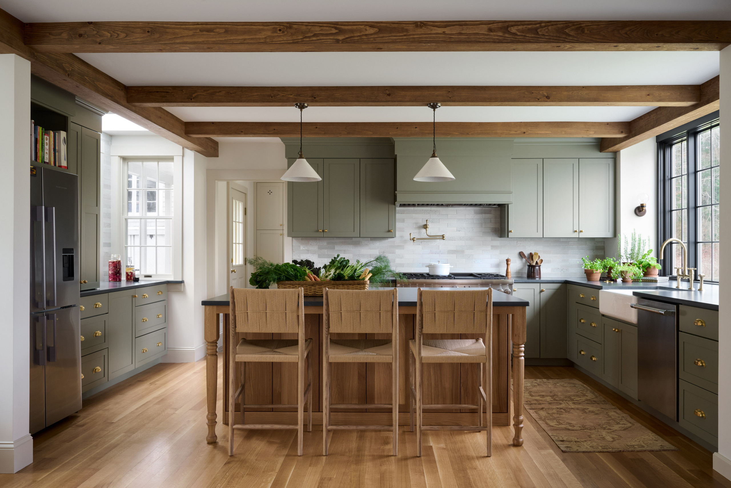 Kitchen from Seaside Colonial home tour designed by Beige and Bleu Design Studio in modern transitional heritage style.