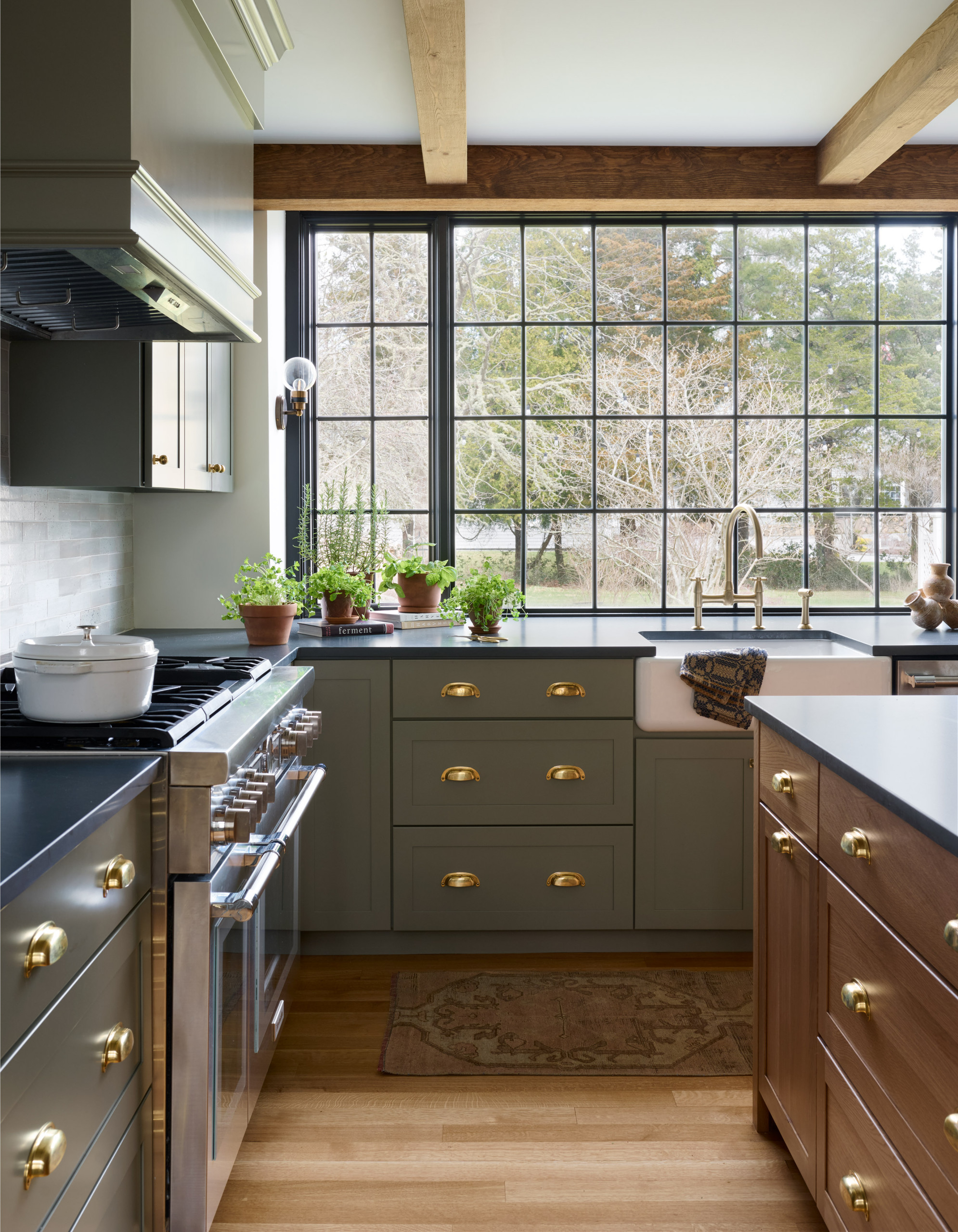 Kitchen from Seaside Colonial home tour designed by Beige and Bleu Design Studio in modern transitional heritage style.