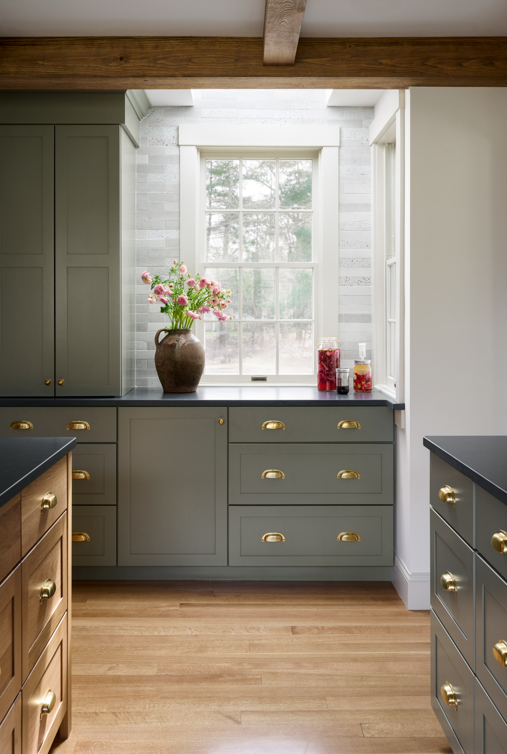 Kitchen from Seaside Colonial home tour designed by Beige and Bleu Design Studio in modern transitional heritage style.